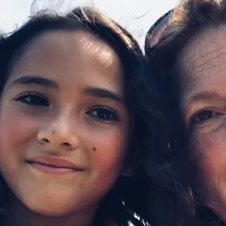 Ellie and her mom meghan smiling outside the gym after taking a kids martial arts class