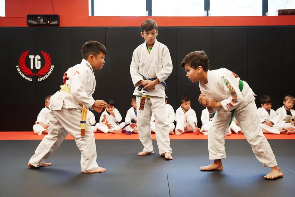 two kids taking a kids martial arts class in bergen county and learning respect